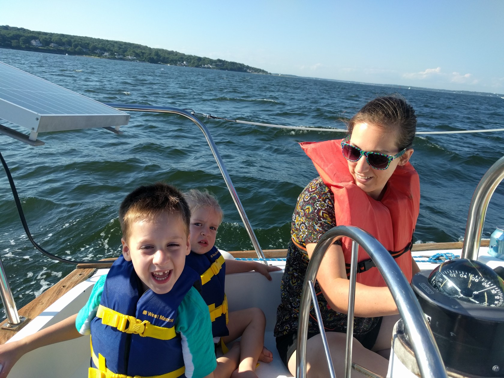 Smiling faces under sail